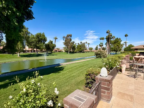 a view of a golf course with a lake view