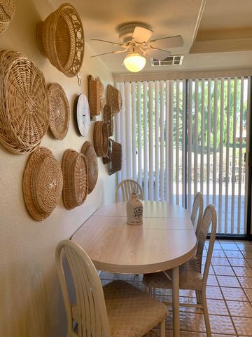 a living room with a couch and painting on the wall