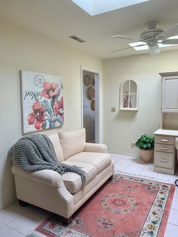 a reading room with furniture and a book shelf