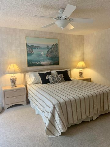 a bedroom with bed and a flat screen tv