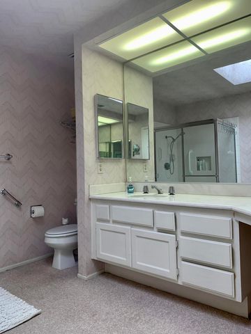 a bathroom that has a glass shower door