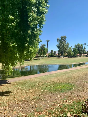a view of a golf course with a lake