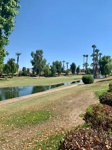 a view of a golf course with a lake