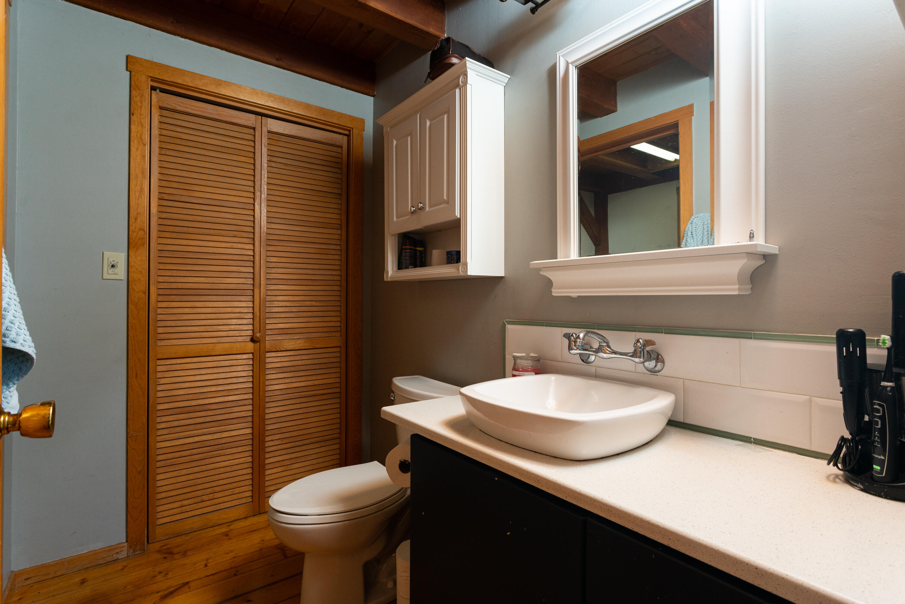 64385 Crosswinds Road Bend, OR 97703 - Photo 11 of 26 Hall bath down stairs, has shower and leads into the laundry room