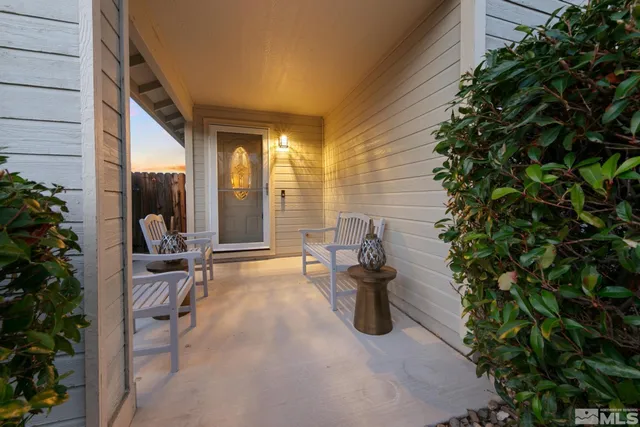 a view of a house with sitting area and garden
