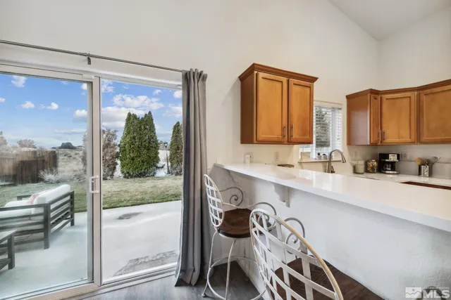 a view of a kitchen with a sink and a window