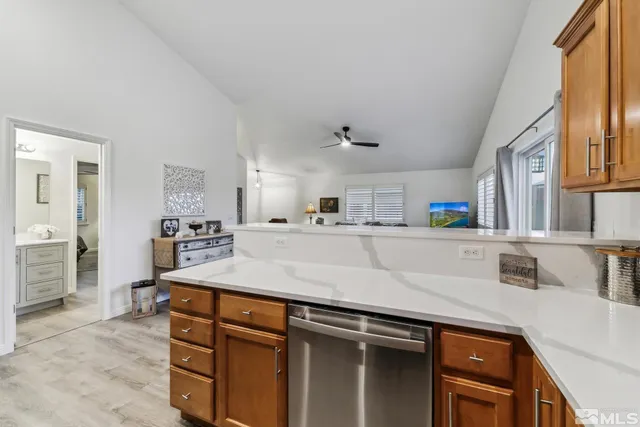 a kitchen with stainless steel appliances granite countertop a sink and dishwasher