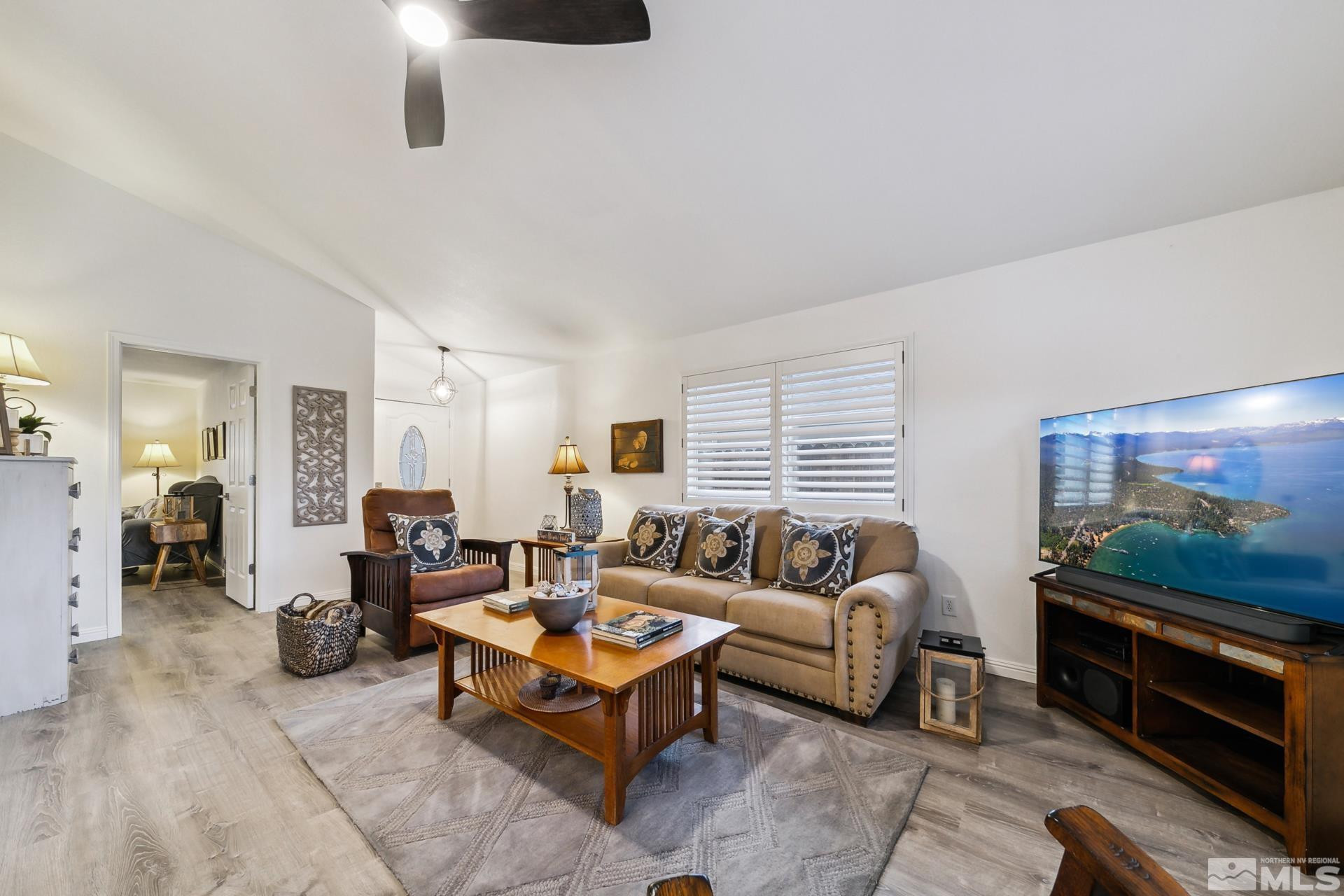 10 Conner Way Gardnerville, NV 89410 - Photo 28 of 40 a living room with furniture and a flat screen tv