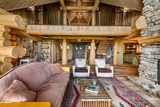 a spacious bathroom with a toilet a sink and a large mirror