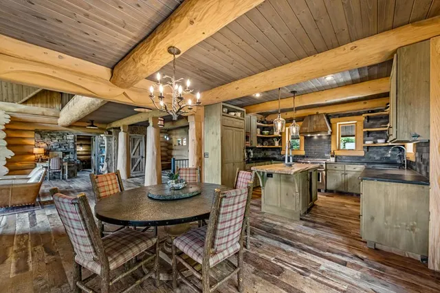 a bedroom with furniture and large windows