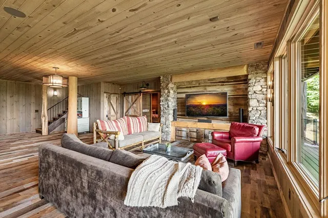 a view of balcony with wooden floor and seating space
