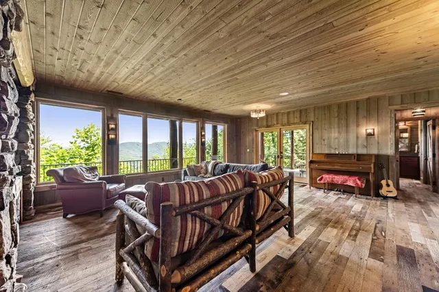 a view of a city with lush green forest