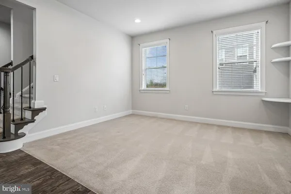 a kitchen with stainless steel appliances granite countertop a sink a stove and a wooden floors