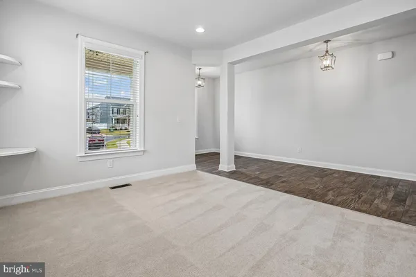 a kitchen with granite countertop cabinets and window