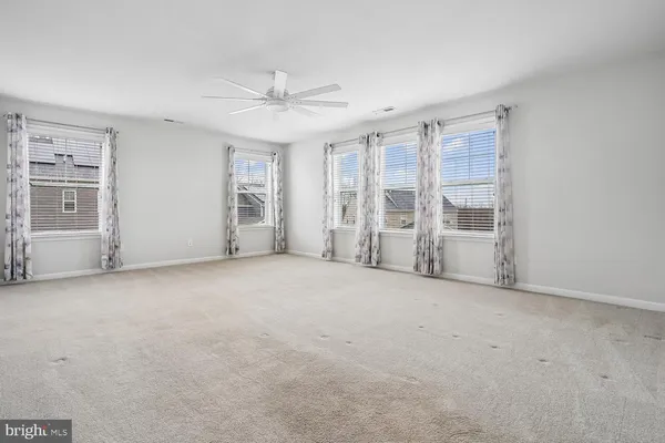 a bathroom with double vanity sink and a mirror