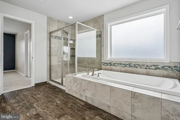 a bathroom with a sink a toilet and a bathtub