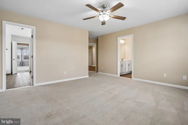 a kitchen with stainless steel appliances granite countertop a refrigerator a sink and a stove