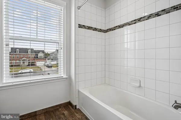 a view of a balcony with wooden floor