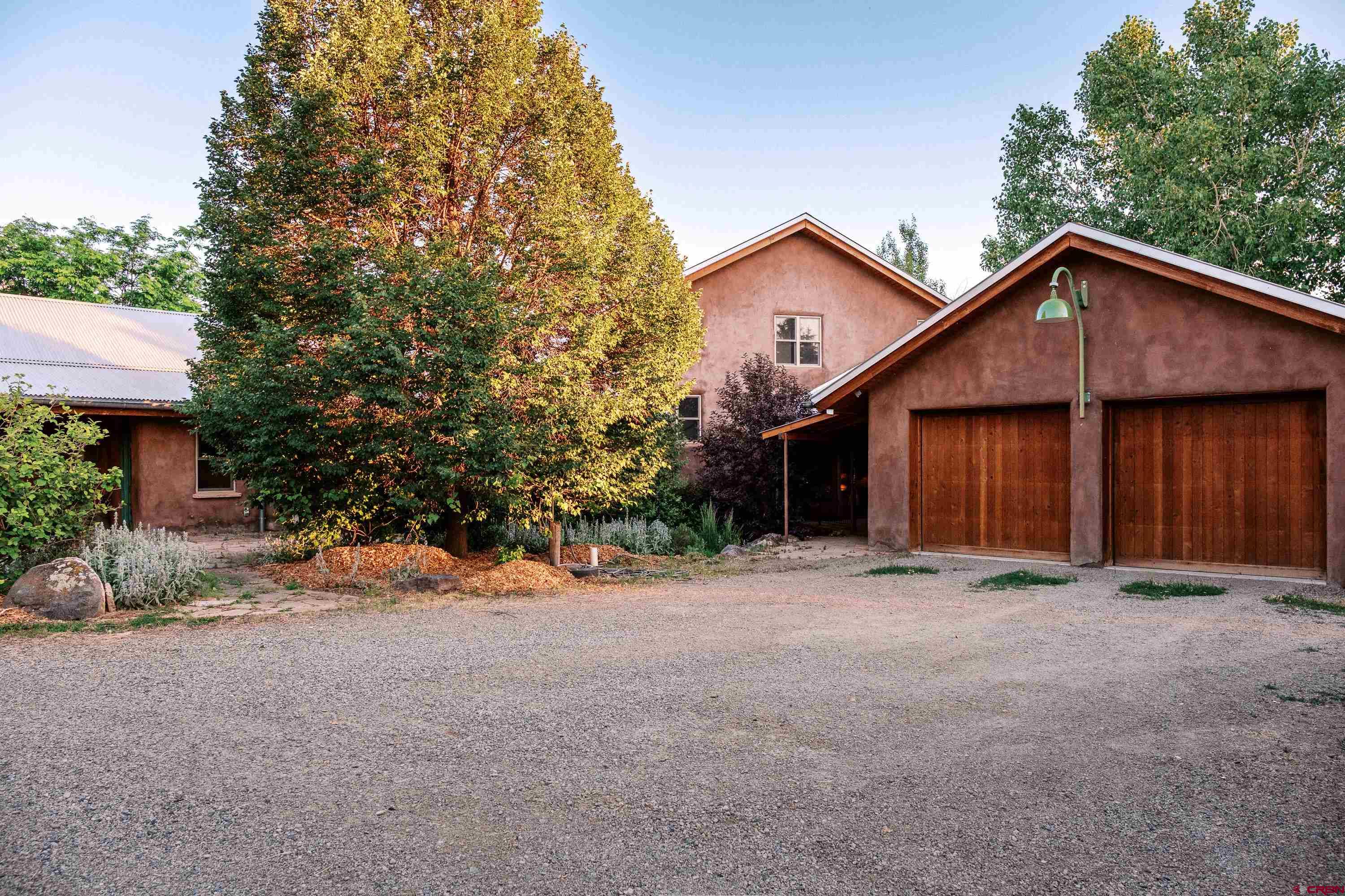 41723 O Road Paonia, CO 81428 - Photo 3 of 44 a view of a house with a yard and garage