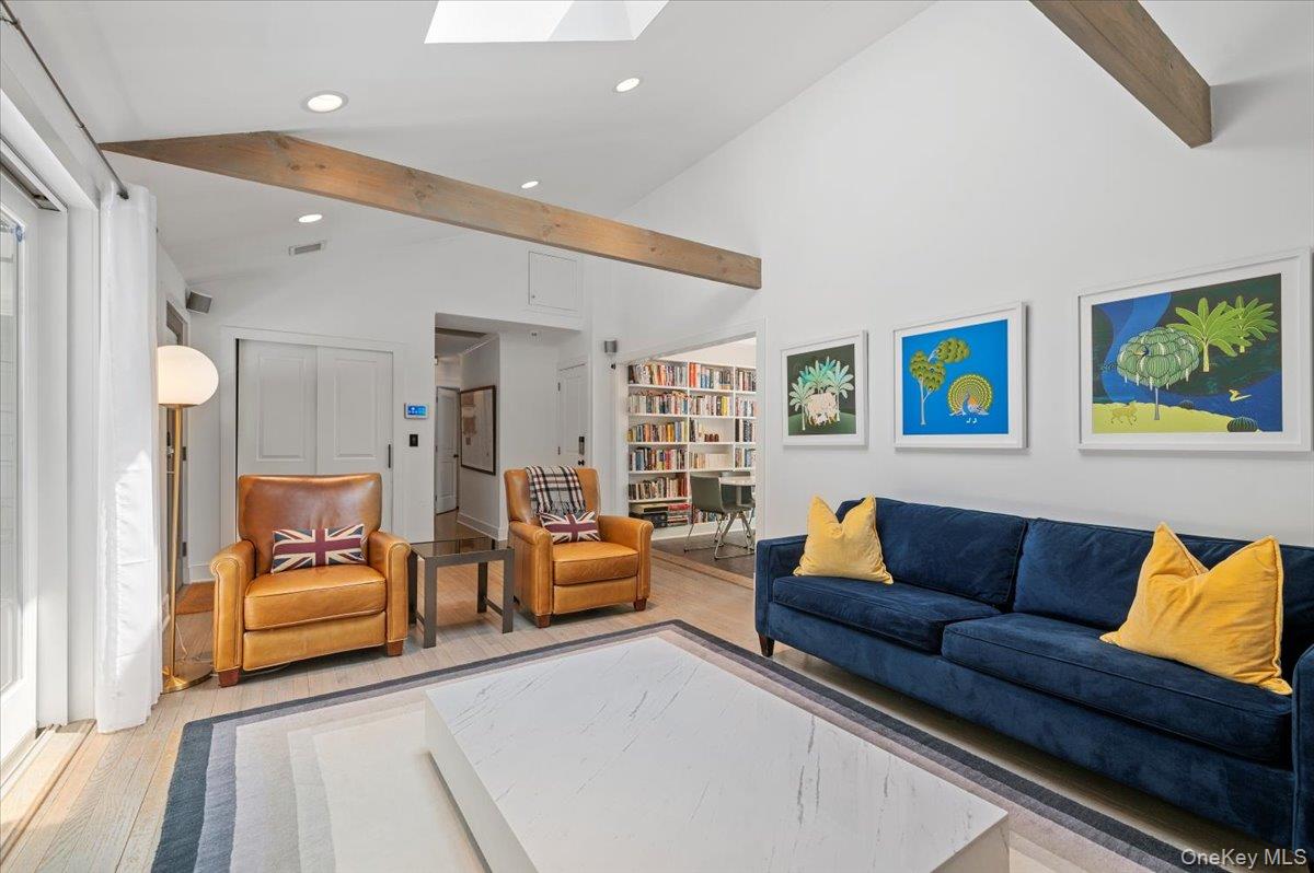 94 Hands Creek Road East Hampton, NY 11937 - Photo 11 of 31 a living room with furniture and a couch