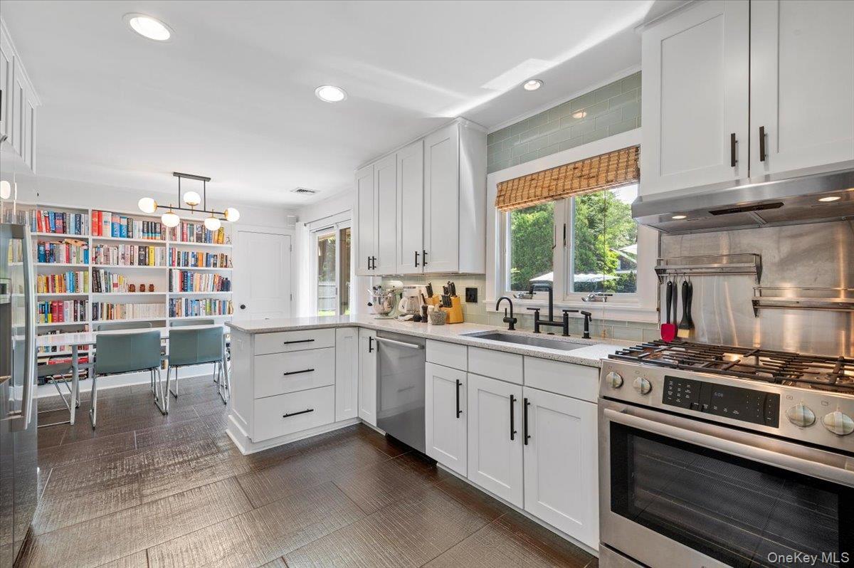 94 Hands Creek Road East Hampton, NY 11937 - Photo 14 of 31 a kitchen with cabinets appliances and a window