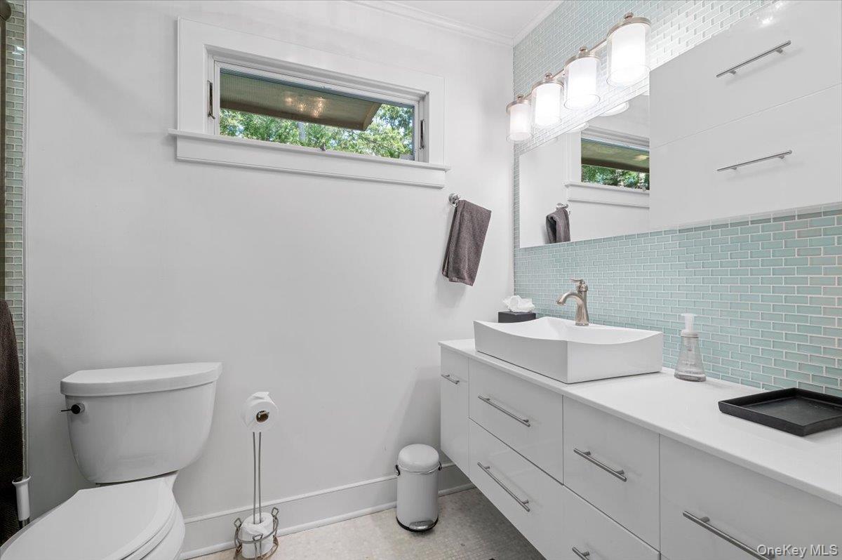 94 Hands Creek Road East Hampton, NY 11937 - Photo 18 of 31 a bathroom with a toilet sink and mirror