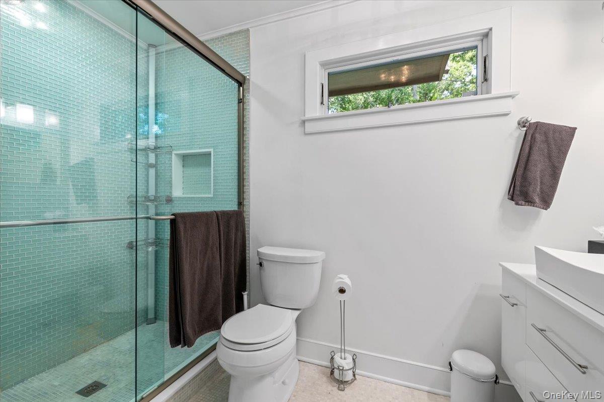 94 Hands Creek Road East Hampton, NY 11937 - Photo 19 of 31 a bathroom with a toilet and a shower