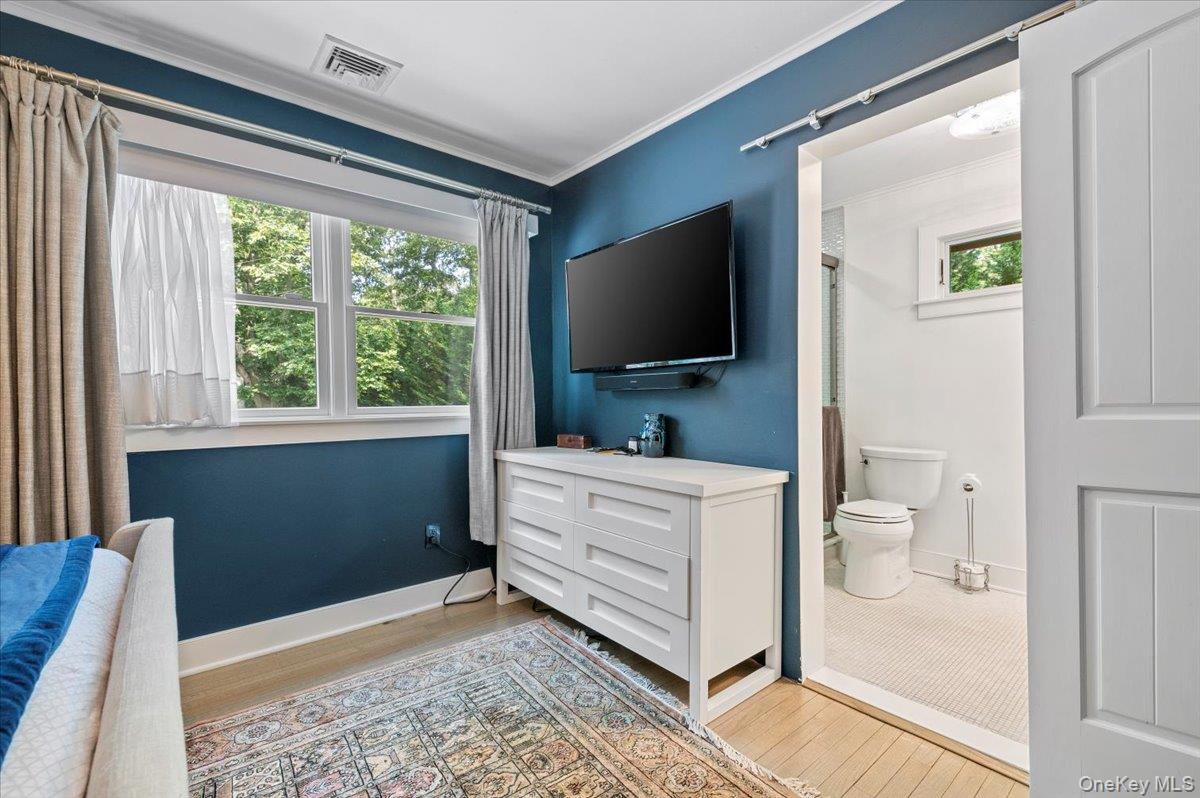 94 Hands Creek Road East Hampton, NY 11937 - Photo 20 of 31 a bathroom with a toilet a sink and a large mirror