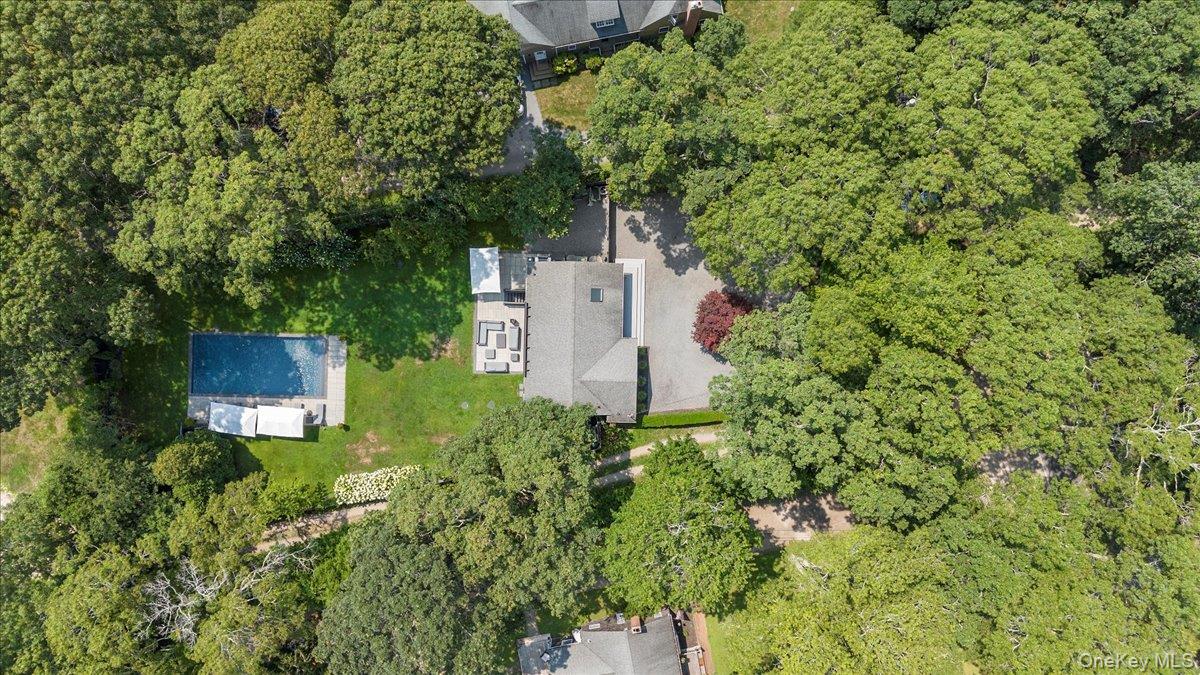 94 Hands Creek Road East Hampton, NY 11937 - Photo 25 of 31 an aerial view of a house with a yard and garden