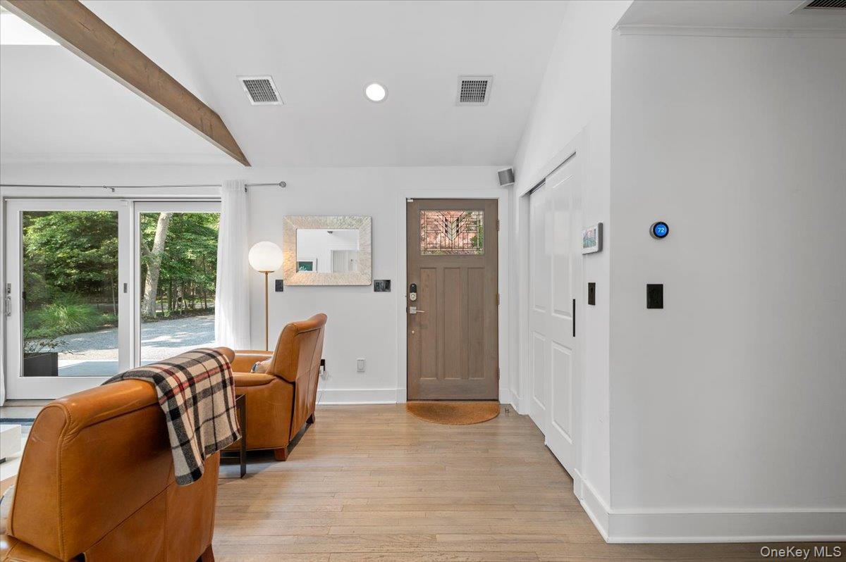 94 Hands Creek Road East Hampton, NY 11937 - Photo 7 of 31 a living room with furniture floor to ceiling window and wooden floor