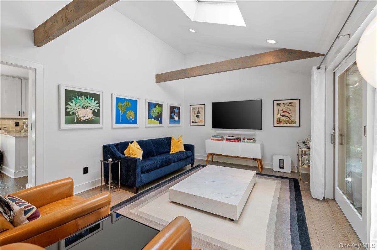 94 Hands Creek Road East Hampton, NY 11937 - Photo 8 of 31 a living room with furniture and a flat screen tv
