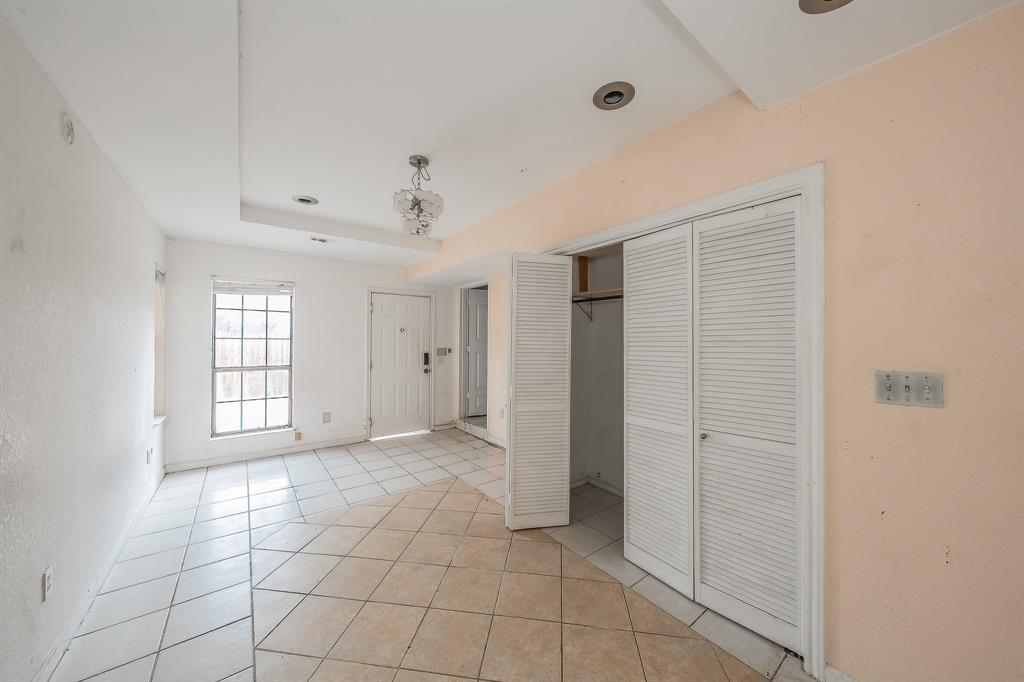 5709 Ranchogrande Drive Arlington, TX 76017 - Photo 27 of 28 a view of an empty room with window and wooden floor