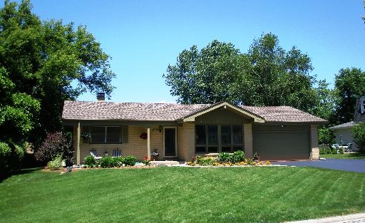 2324 Beck Road Lindenhurst, IL 60046 - Photo 1 of 1 a front view of a house with a garden