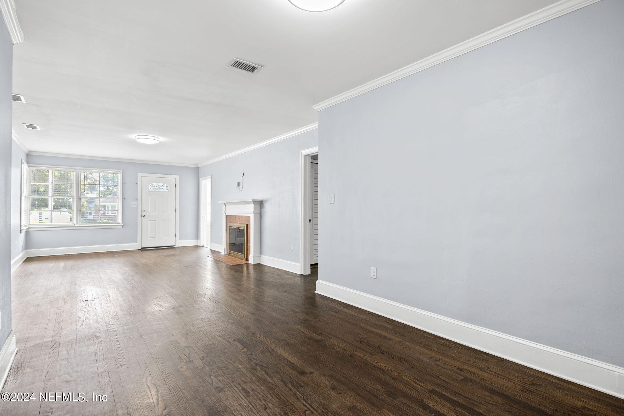 746 Hamilton Street Jacksonville, FL 32205 - Photo 11 of 28 a view of an empty room with wooden floor and a window