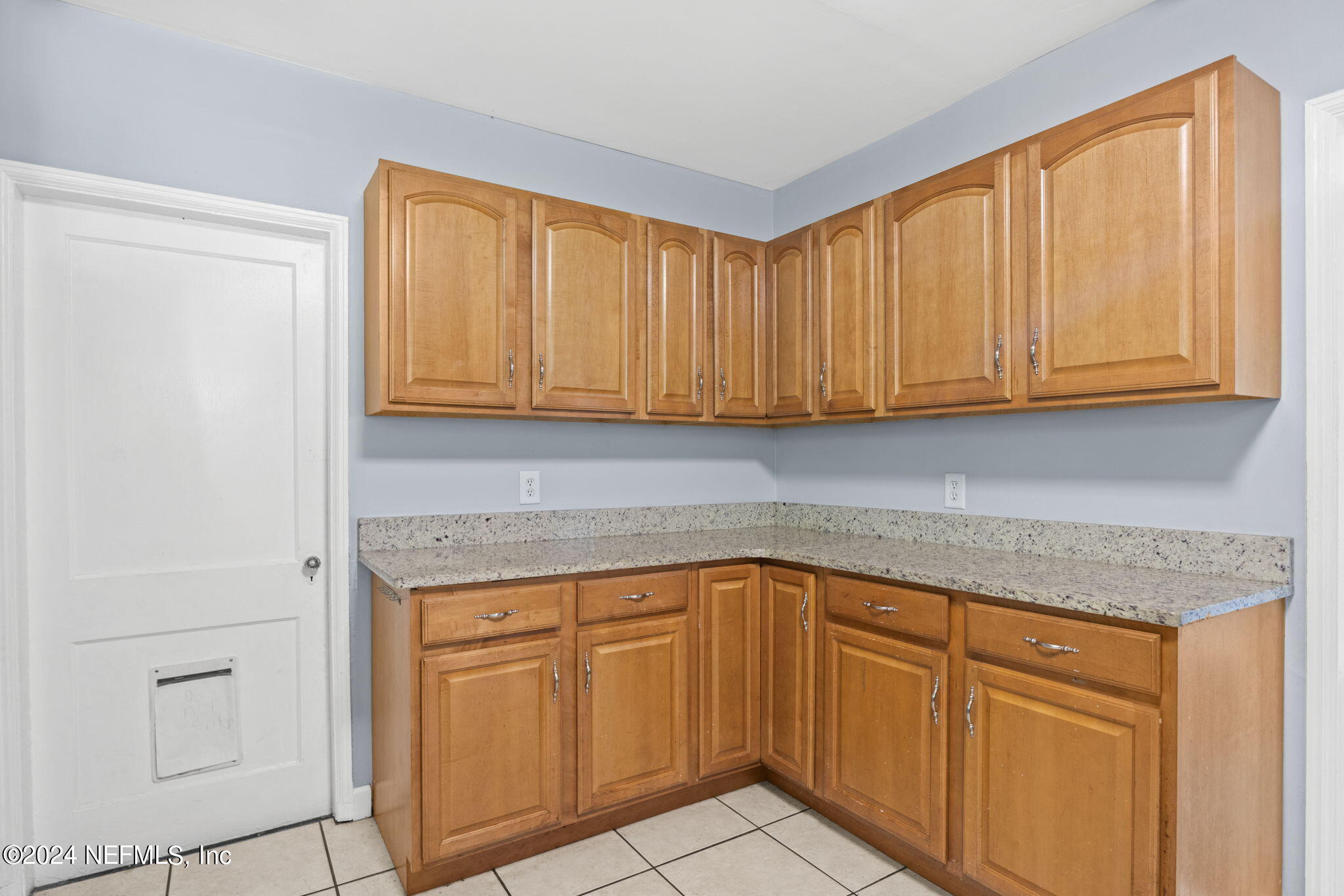 746 Hamilton Street Jacksonville, FL 32205 - Photo 17 of 28 a kitchen with granite countertop cabinets stainless steel appliances wooden floor and a window