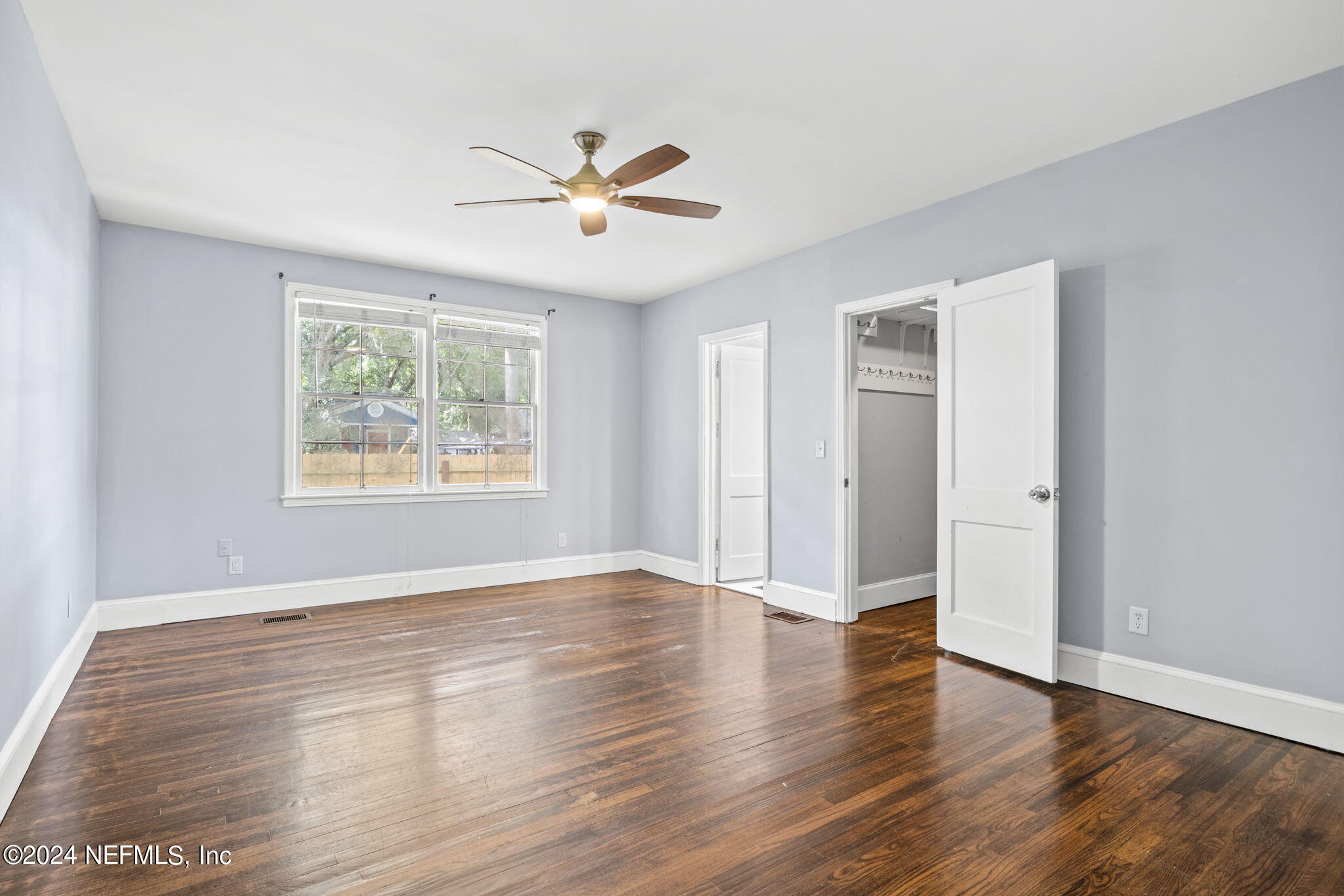 746 Hamilton Street Jacksonville, FL 32205 - Photo 19 of 28 a view of an empty room with wooden floor and window