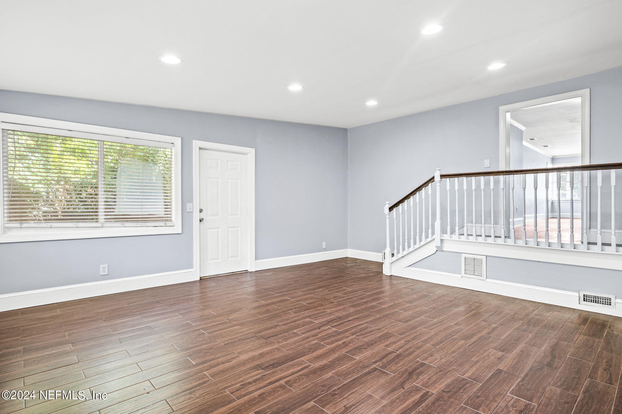746 Hamilton Street Jacksonville, FL 32205 - Photo 25 of 28 a view of an empty room with wooden floor and a window