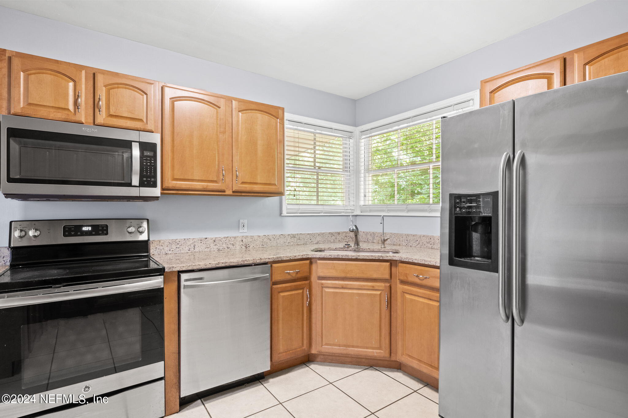 746 Hamilton Street Jacksonville, FL 32205 - Photo 5 of 28 a kitchen with cabinets stainless steel appliances and window
