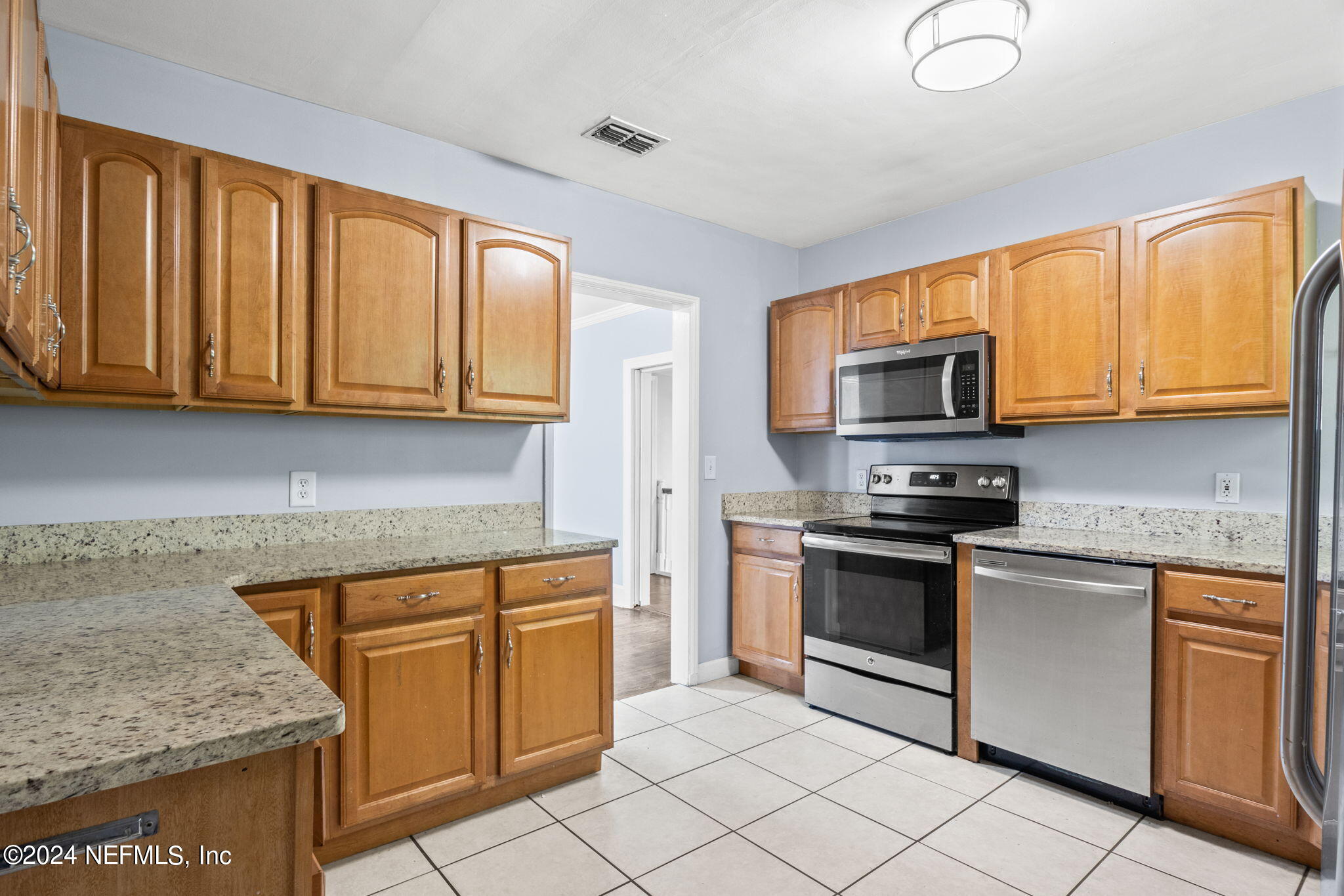 746 Hamilton Street Jacksonville, FL 32205 - Photo 6 of 28 a kitchen with stainless steel appliances granite countertop a stove top oven a sink dishwasher and granite counter top