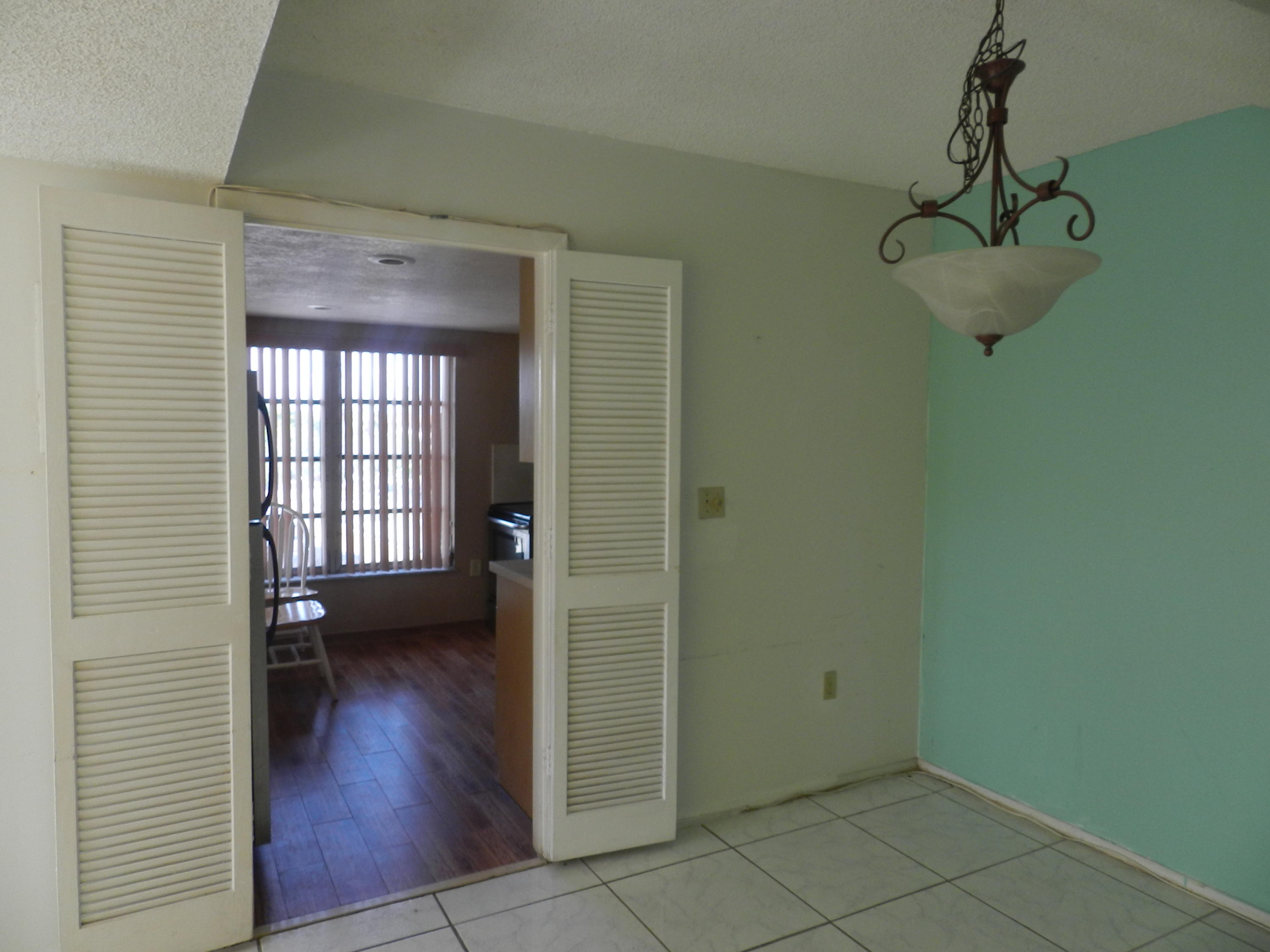 4160 Inverrary Drive, Unit 401 Lauderhill, FL 33319 - Photo 2 of 9 a view of a room with wooden floor and windows