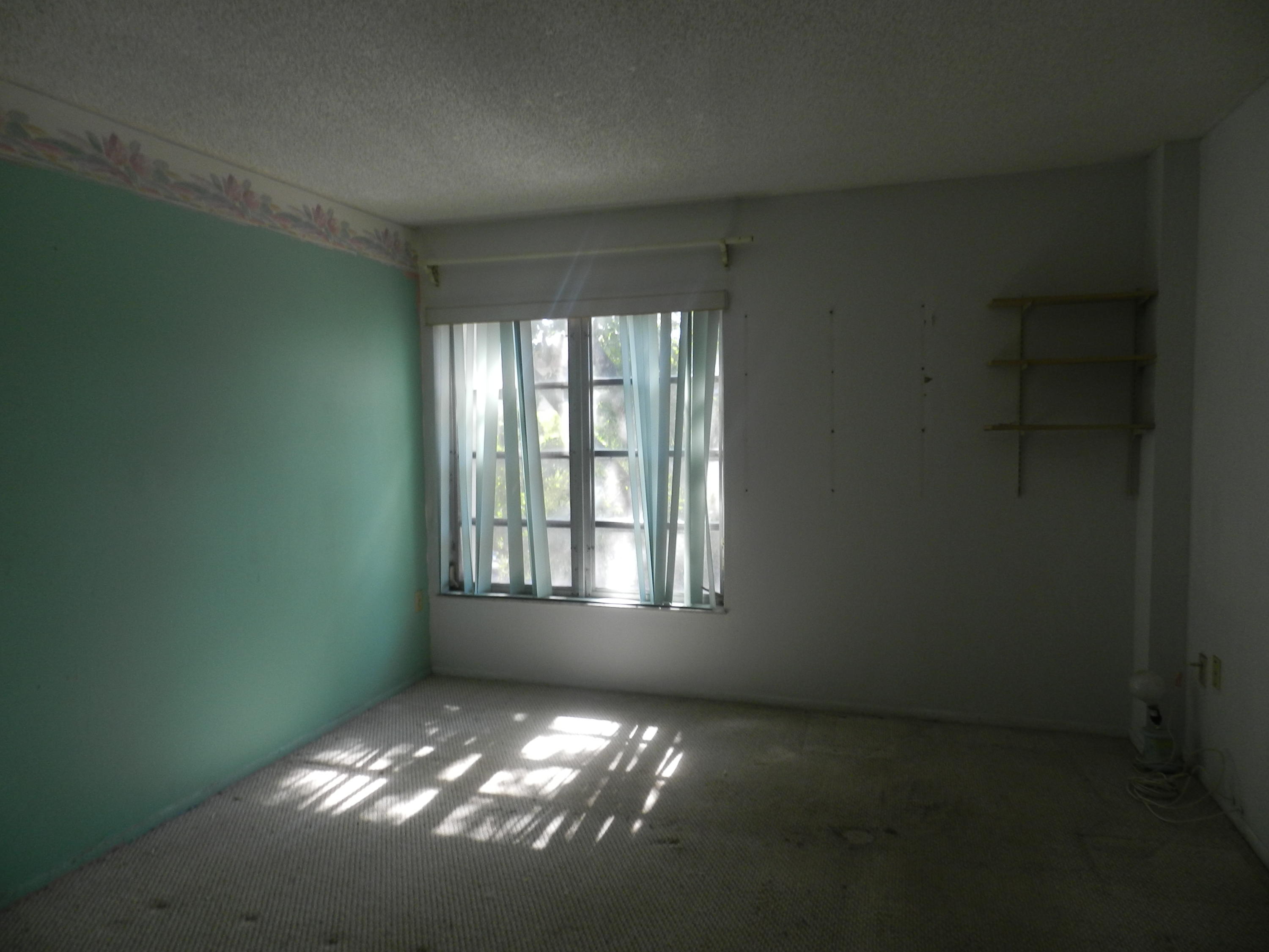4160 Inverrary Drive, Unit 401 Lauderhill, FL 33319 - Photo 5 of 9 an empty room with windows