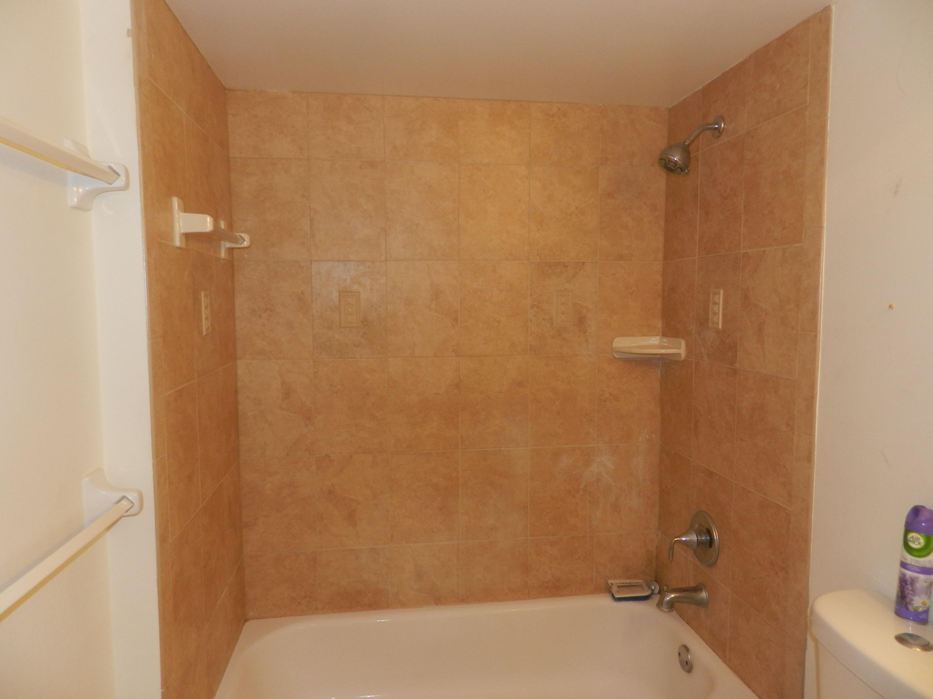 4160 Inverrary Drive, Unit 401 Lauderhill, FL 33319 - Photo 8 of 9 a bathroom with a shower and a toilet