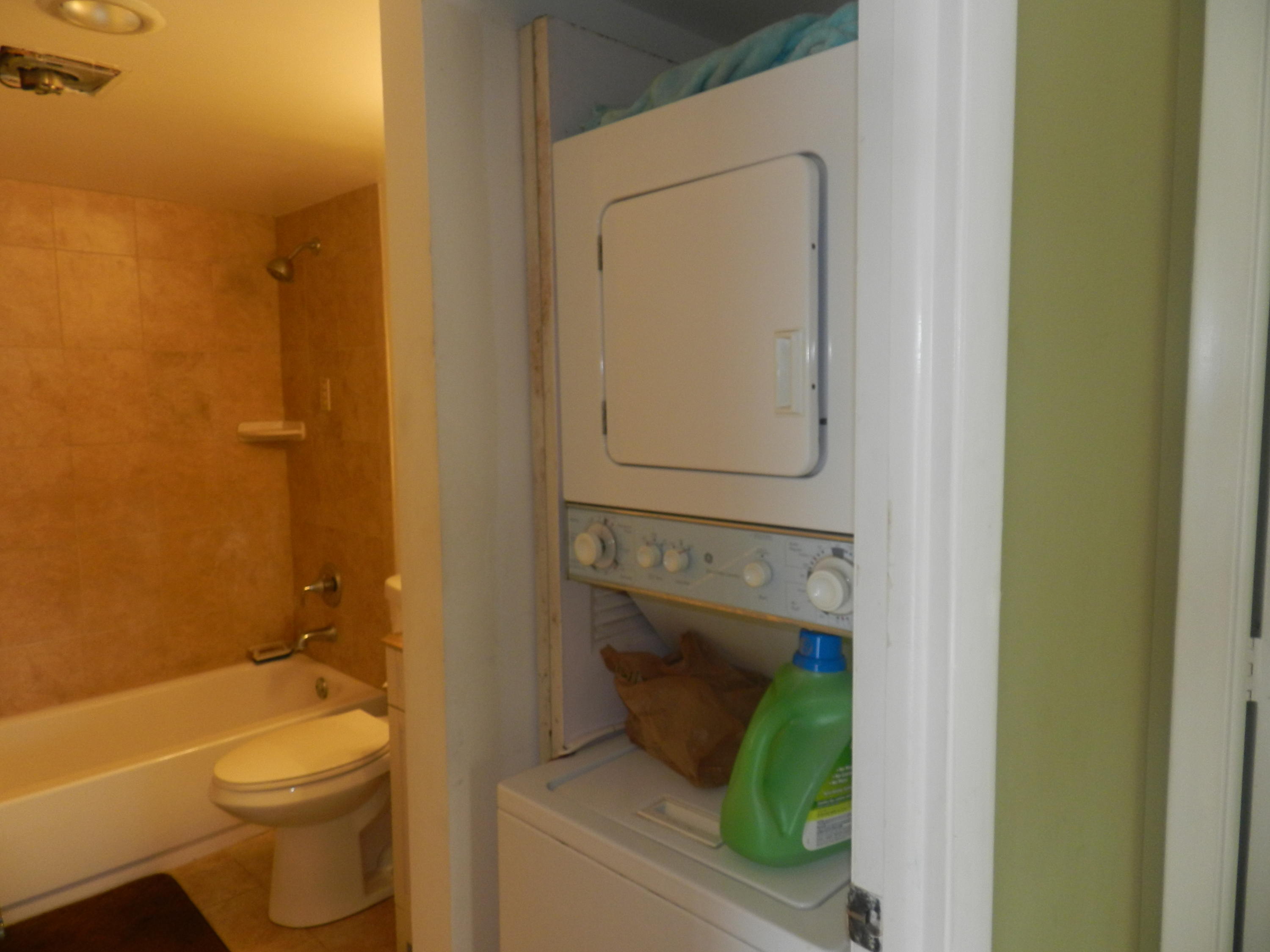 4160 Inverrary Drive, Unit 401 Lauderhill, FL 33319 - Photo 9 of 9 a bathroom with a granite countertop toilet and a sink