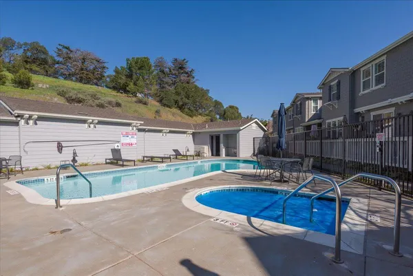 a view of outdoor space with seating area and swimming pool