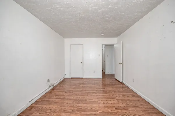 a bathroom with a sink a mirror toilet and bathtub