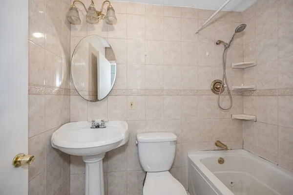 a kitchen with a table chairs sink and cabinets