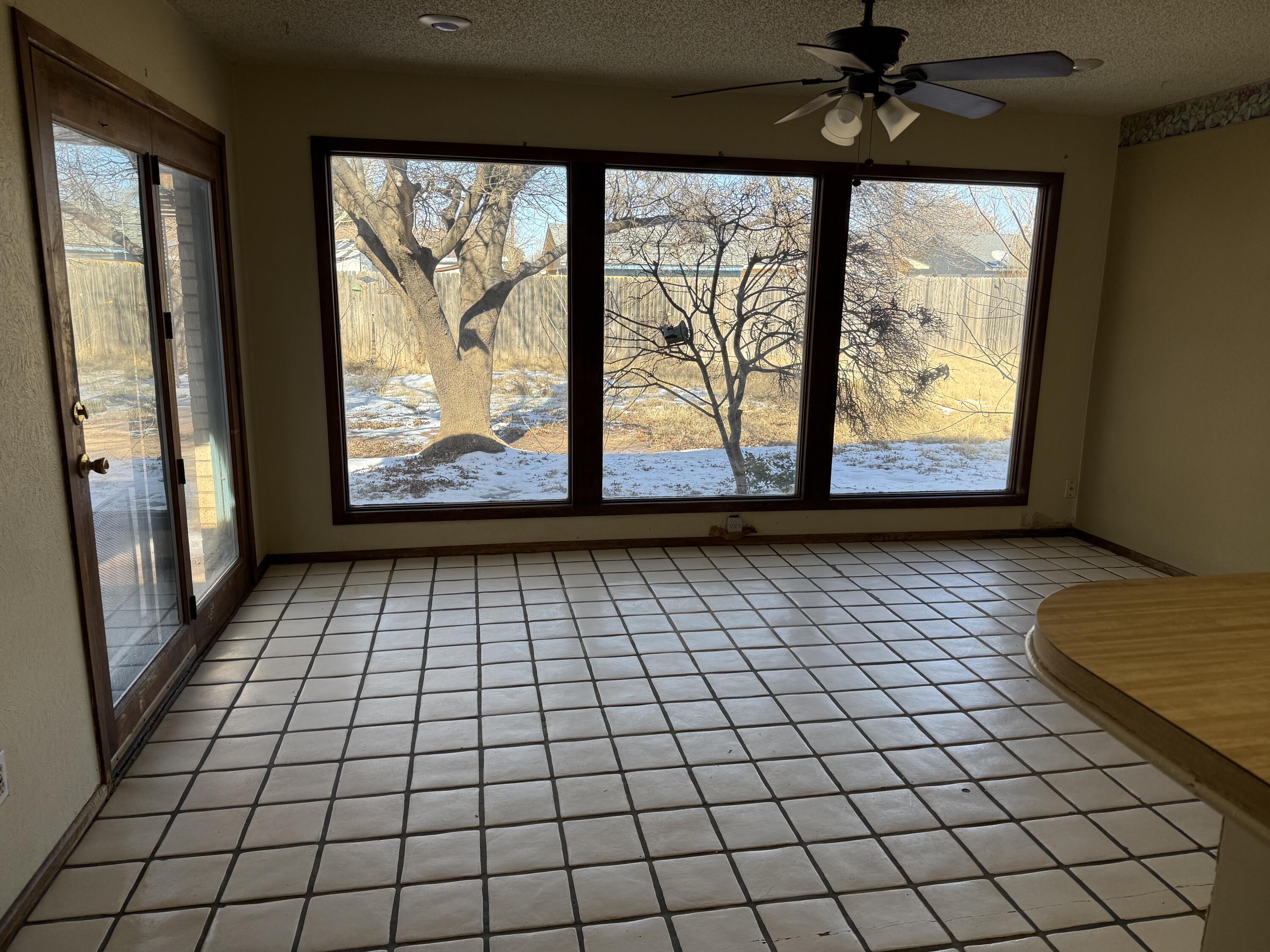 4418 58th Street Lubbock, TX 79414 - Photo 3 of 11 an empty room with windows