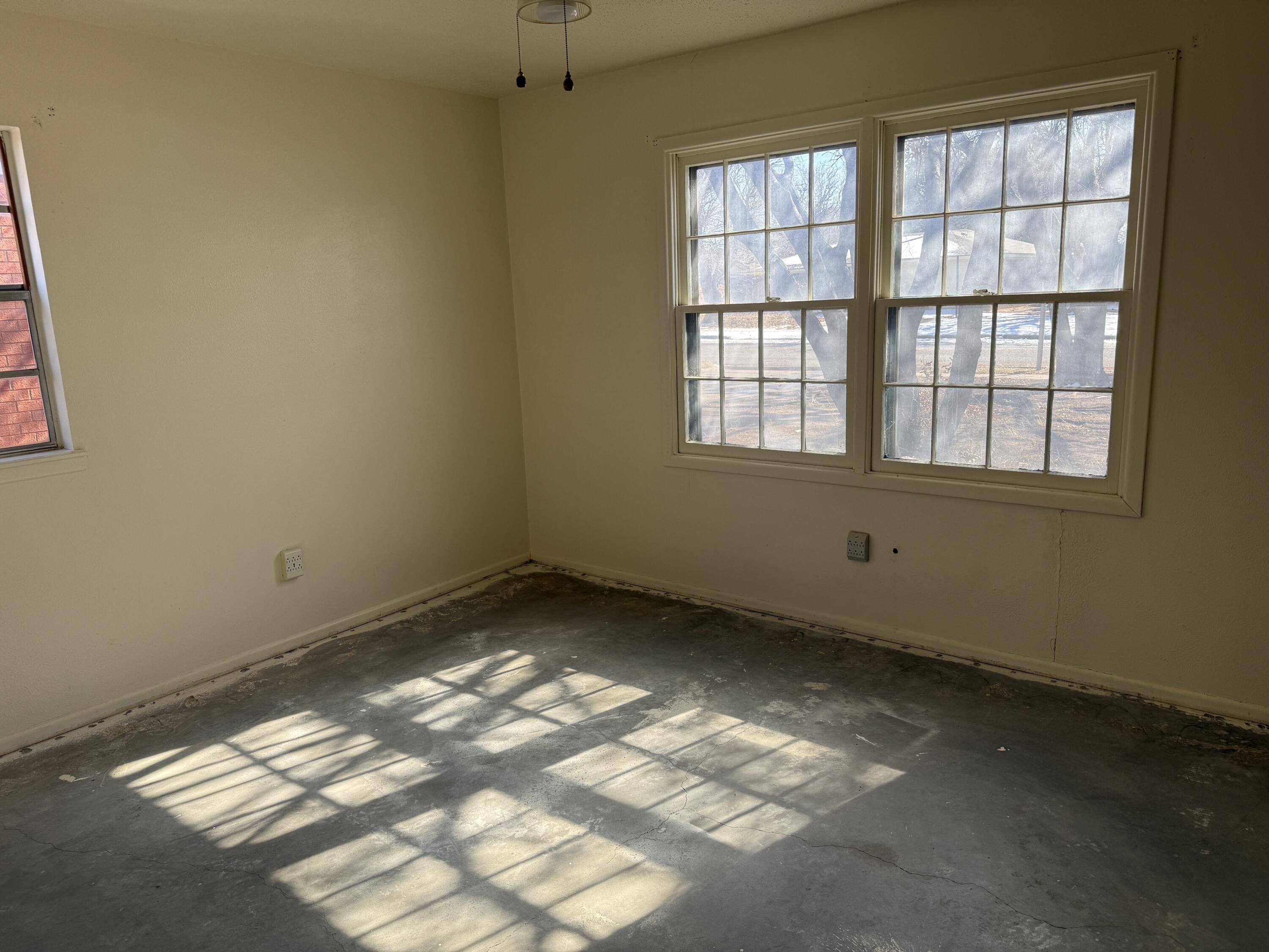 4418 58th Street Lubbock, TX 79414 - Photo 8 of 11 an empty room with a window