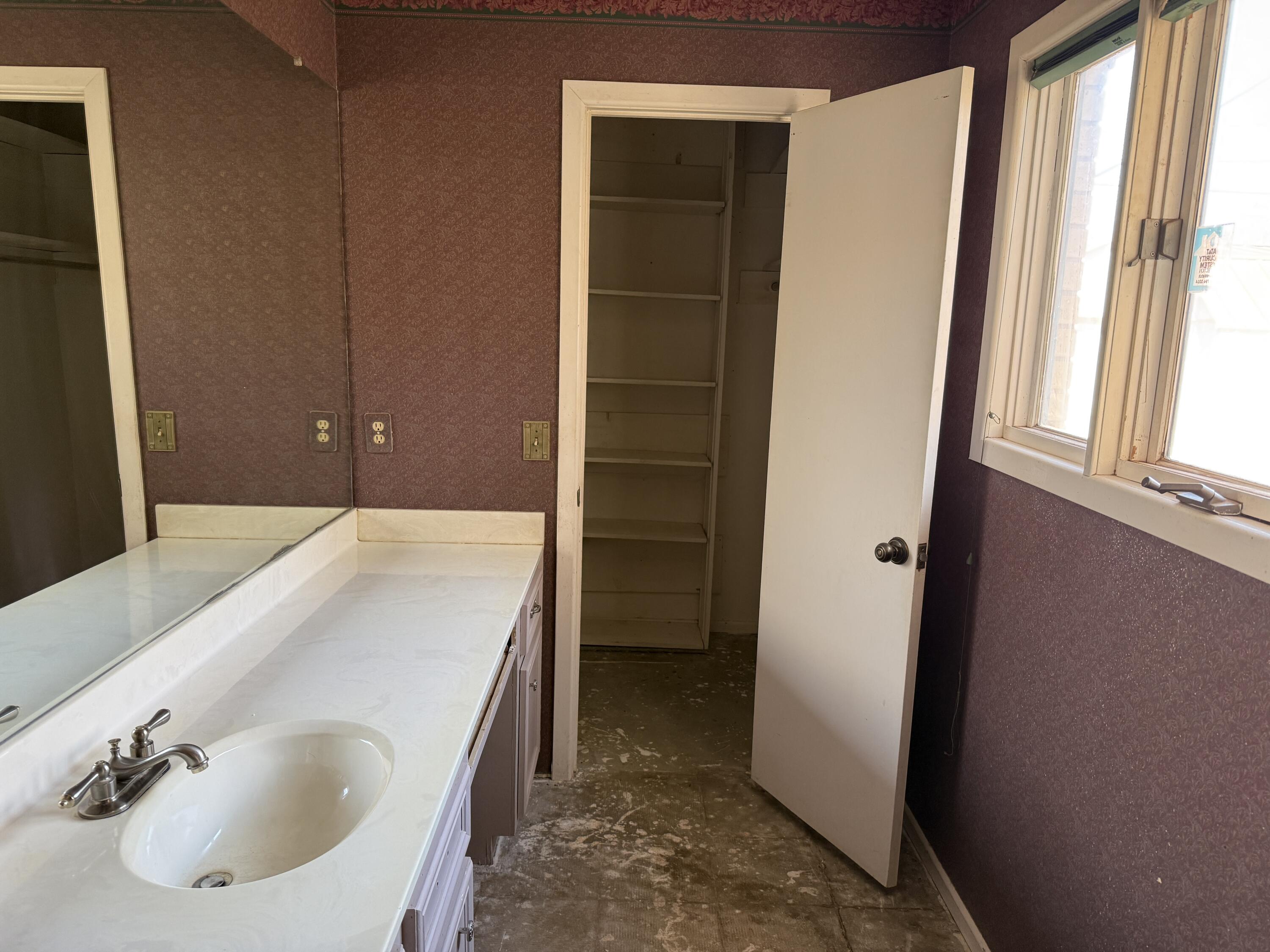 4418 58th Street Lubbock, TX 79414 - Photo 10 of 11 a en suite bathroom with a sink and a tub