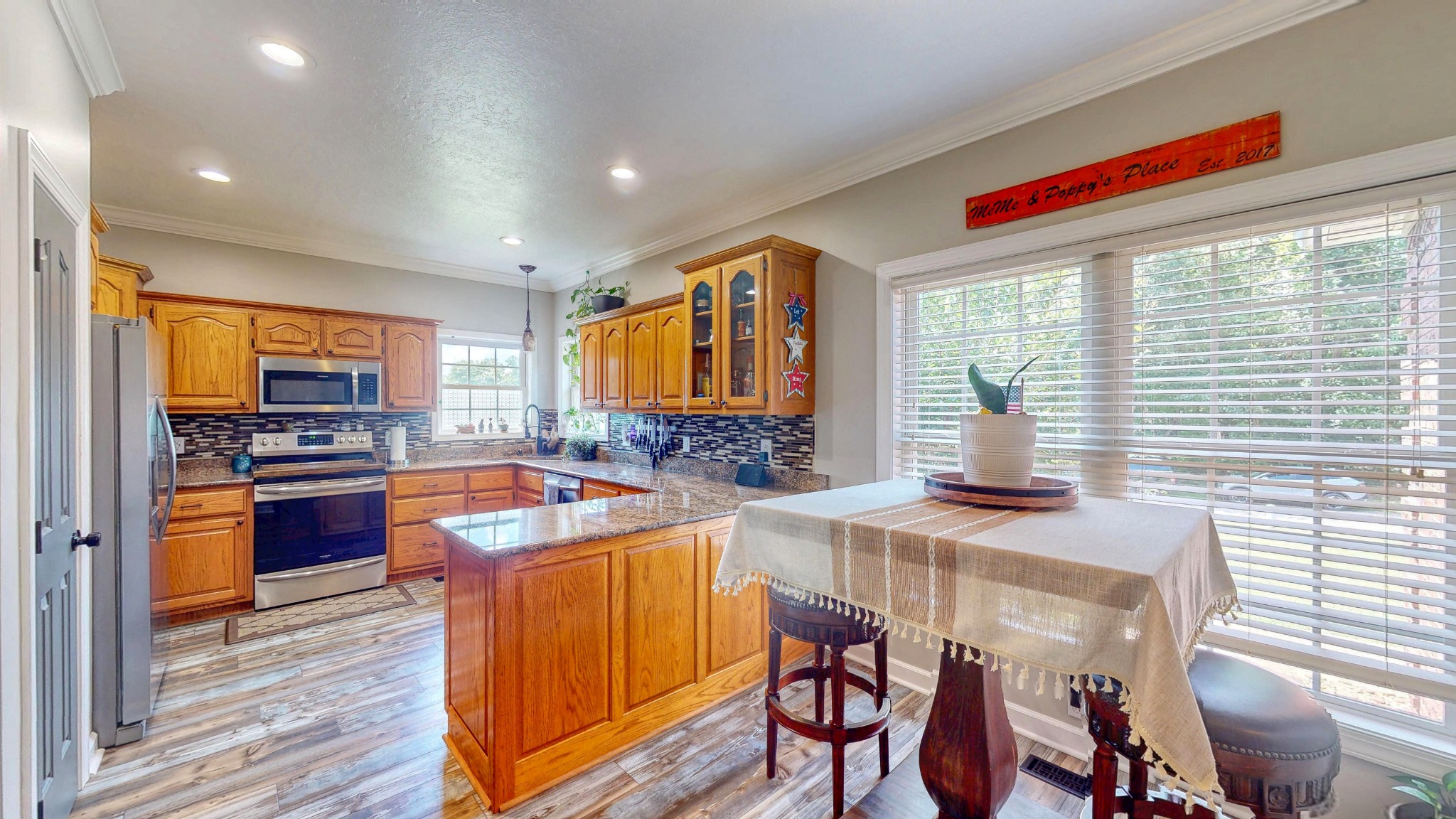 382 Timber Lane Huntingdon, TN 38344 - Photo 20 of 32 a kitchen with stainless steel appliances granite countertop sink stove top oven and cabinets
